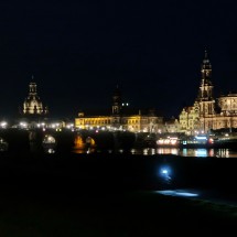 Skyline of the old town of Dresden with river Elbe, bridge Augustusbrücke, church Frauenkirche (left center) and cathedral Ss Trinitadis (right)